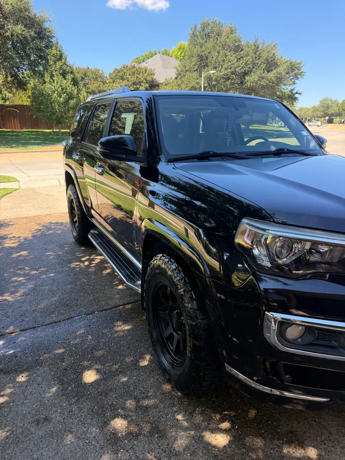 Glossy black SUV after mobile detailing